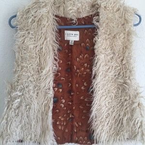 I love H81 Forever 21 Fluffy cream vest.